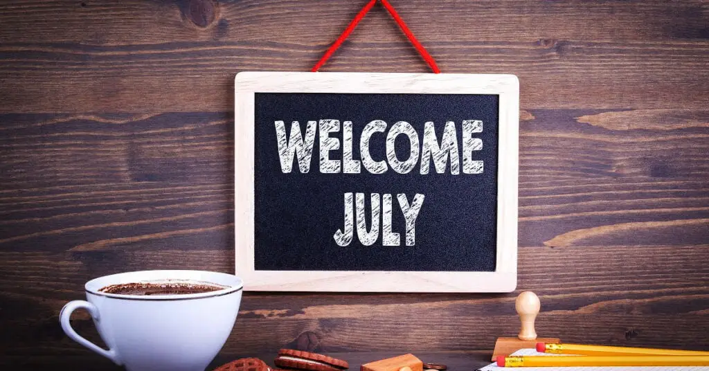 A cup of coffee and a welcome message to July focusing on balance and positivity