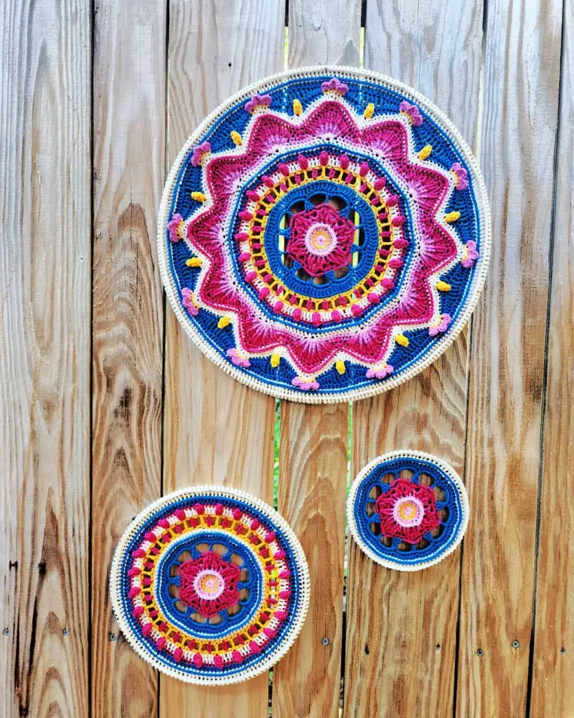 Enigma Mandalas Set Crocheted by Just Sabi and displayed on a wall