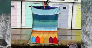 Hannah holding up "Summer in Swanage" so Dedri Uys could take photos.